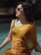 Taapsee Pannu sets fire in the pool wearing a saree